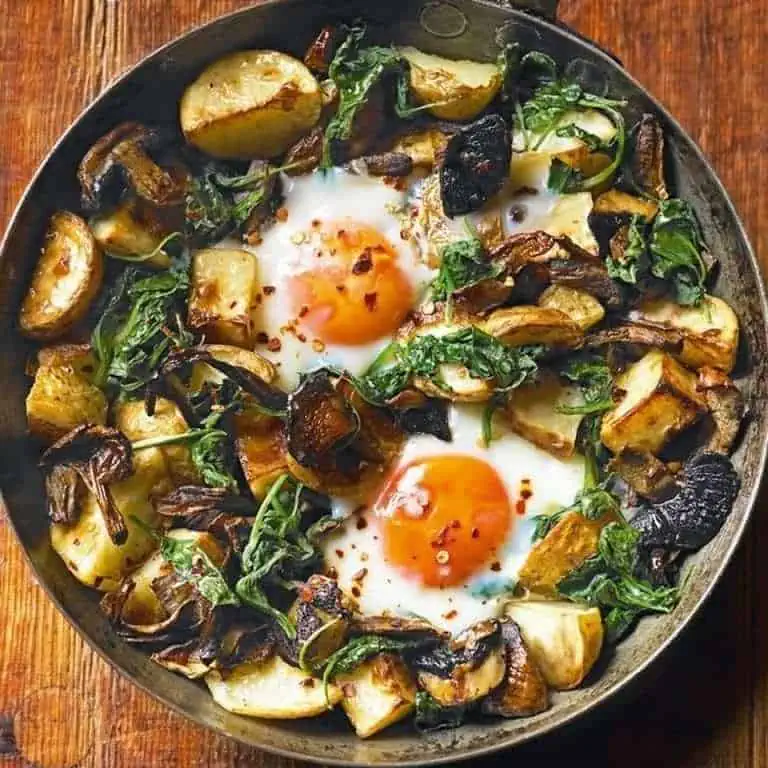 Oyster mushrooms with baked eggs, potatoes, spinach and cheese